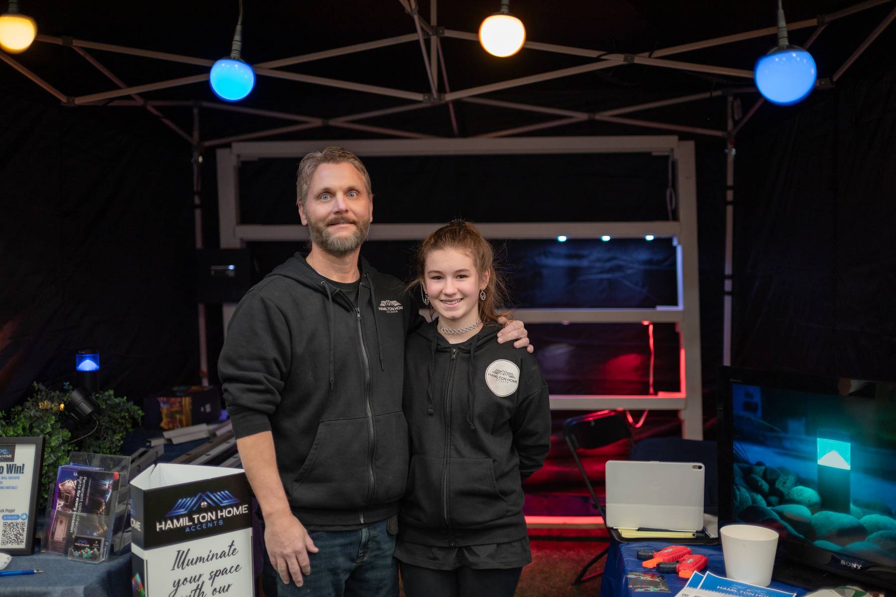 Hamilton Home Accents team at a promotional booth